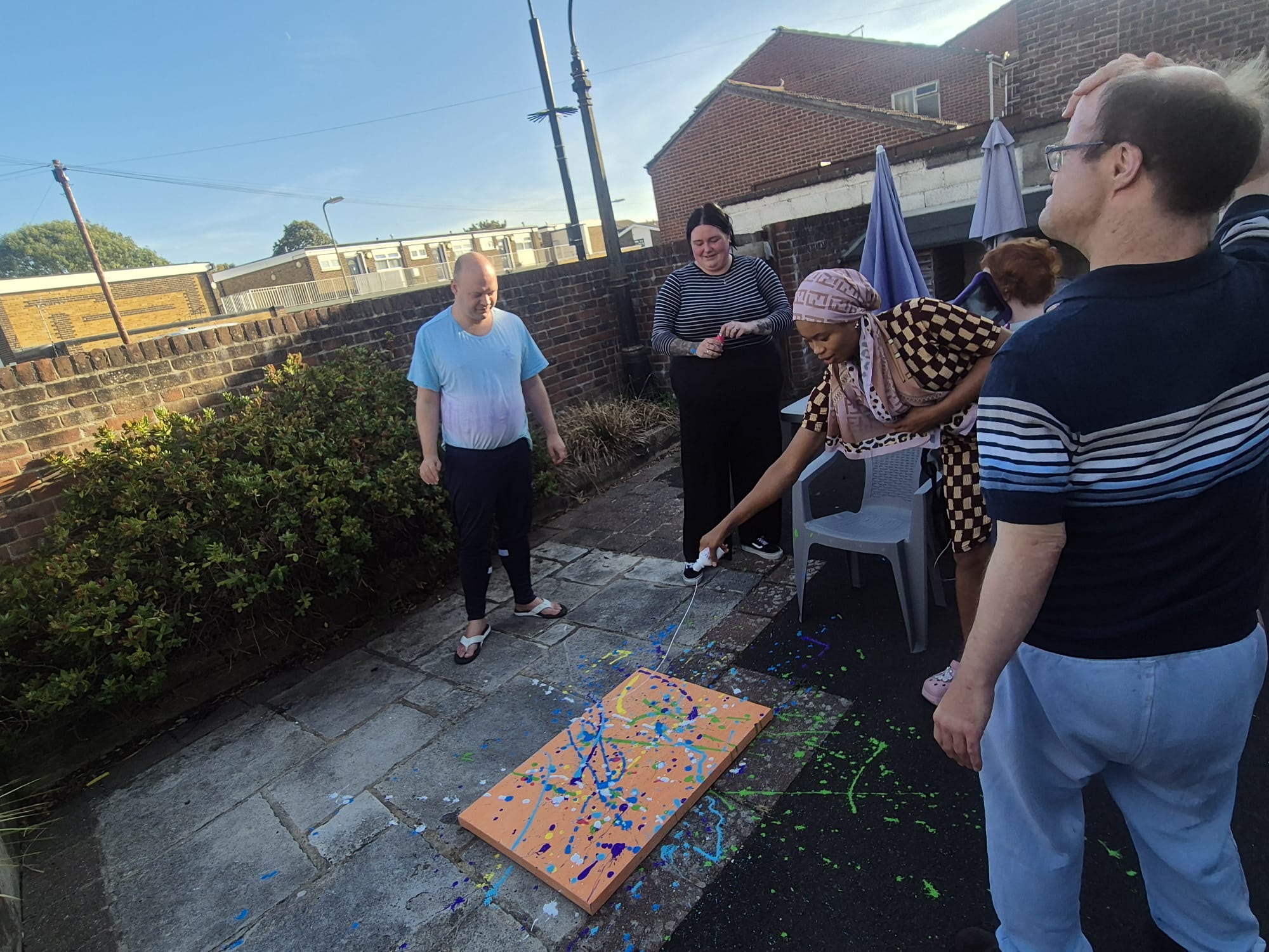 People enjoying a creative outdoor activity at The Royal